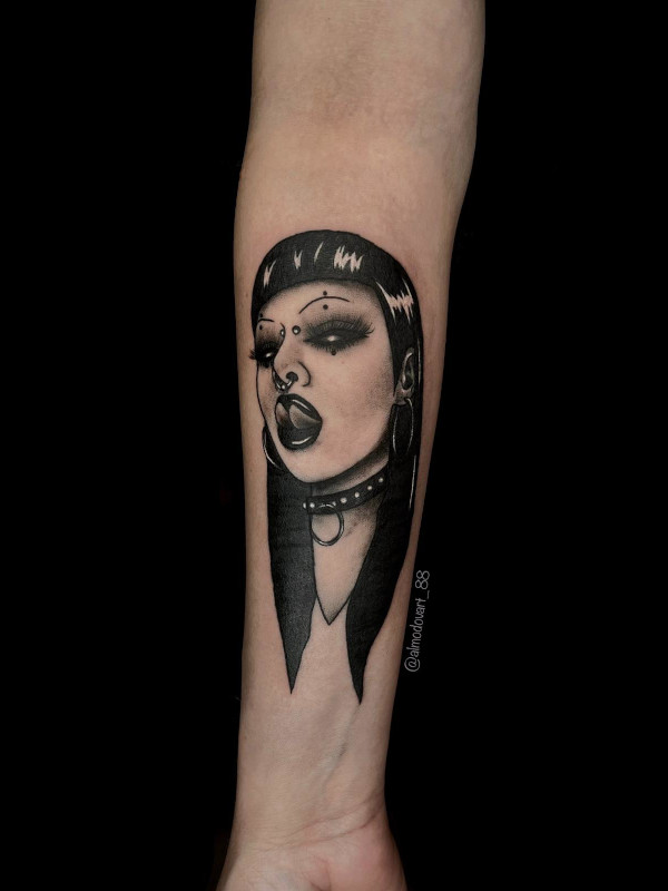 Black and grey tattoo of a goth girl with piercings by tattoo artist Lita Almodovar.